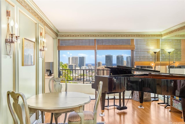 965 Prospect St Unit 604, Honolulu, HI 96822 - dining room with crown molding, wood finished floors, and a skyline view