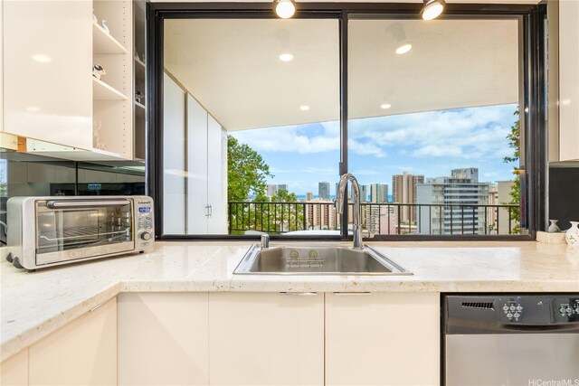 965 Prospect St Unit 604, Honolulu, HI 96822 - kitchen featuring dishwasher, white cabinetry, and a city view
