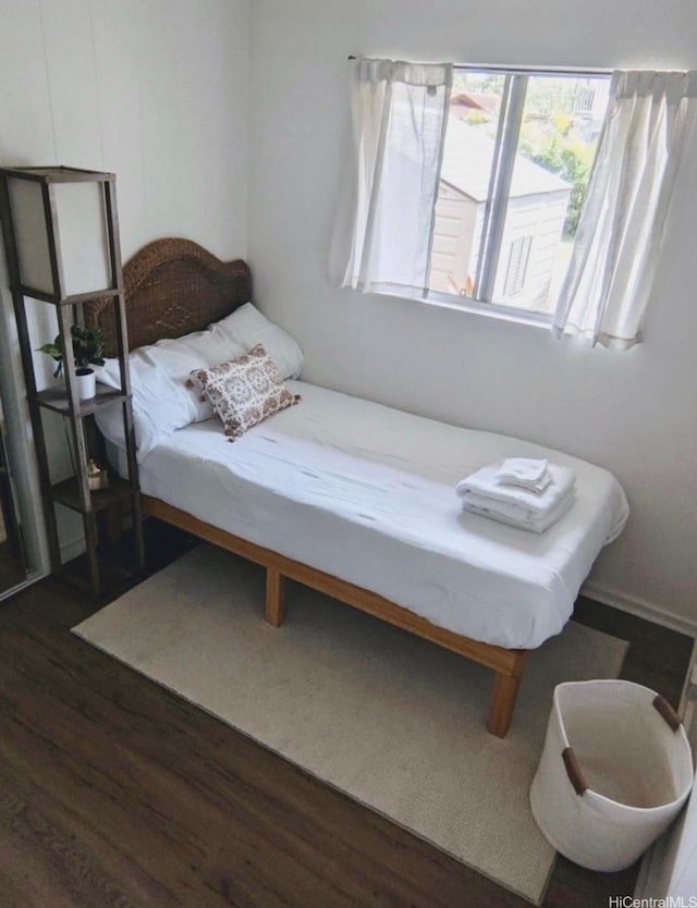 66-924 Kamakahala St, Waialua, HI 96791 - bedroom featuring dark wood-type flooring