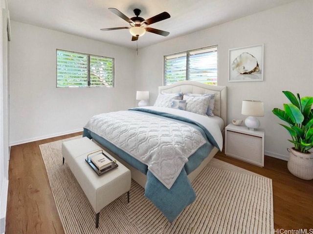 66-924 Kamakahala St, Waialua, HI 96791 - bedroom featuring multiple windows, wood finished floors, and a ceiling fan