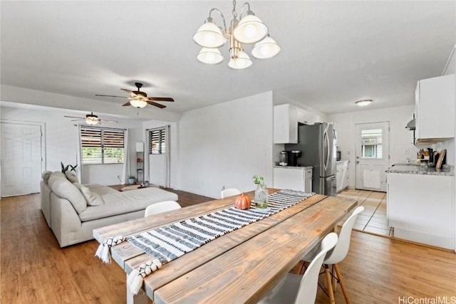 66-924 Kamakahala St, Waialua, HI 96791 - dining space with plenty of natural light, a chandelier, and light wood-style flooring
