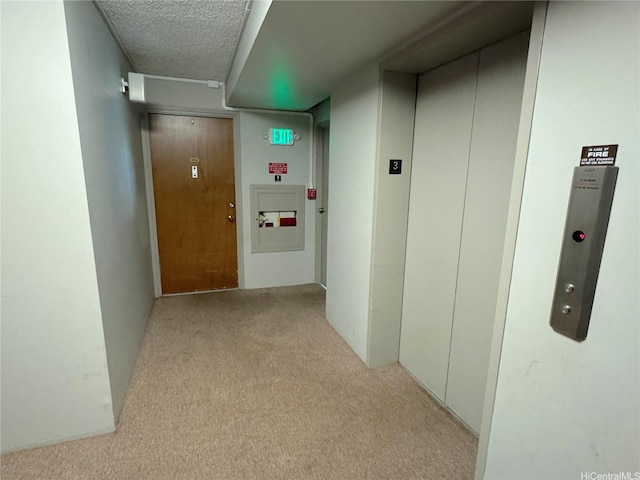 2055 Nuuanu Ave Unit 304, Honolulu, HI 96817 - corridor with carpet, elevator, and a textured ceiling