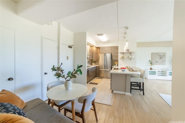 2333 Kapiolani Blvd Unit 311, Honolulu, HI 96826 - dining room featuring light wood-type flooring