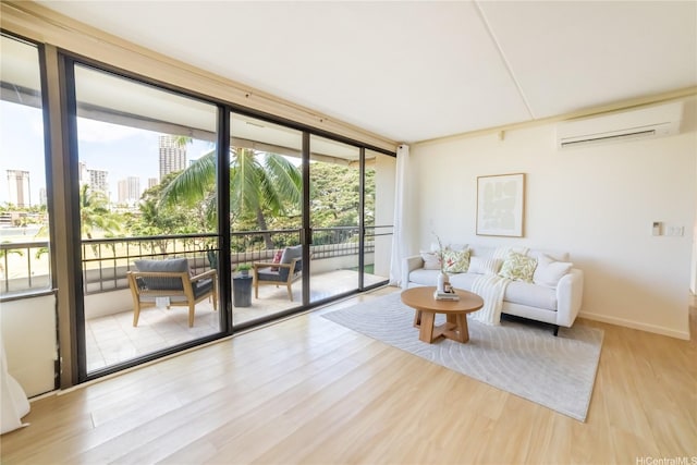 2333 Kapiolani Blvd Unit 311, Honolulu, HI 96826 - living area featuring an AC wall unit, wood finished floors, floor to ceiling windows, and a city view
