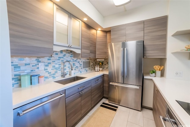 2333 Kapiolani Blvd Unit 311, Honolulu, HI 96826 - kitchen featuring appliances with stainless steel finishes, light tile patterned floors, backsplash, light countertops, and open shelves