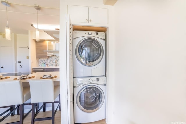 2333 Kapiolani Blvd Unit 311, Honolulu, HI 96826 - laundry room with estacked washer and dryer and a sink