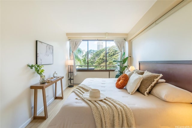 2333 Kapiolani Blvd Unit 311, Honolulu, HI 96826 - bedroom with light wood finished floors and baseboards