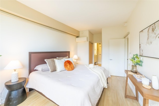 2333 Kapiolani Blvd Unit 311, Honolulu, HI 96826 - bedroom featuring an AC wall unit and wood finished floors