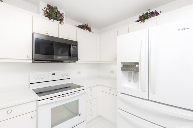 725 Kapiolani Blvd Unit 1201, Honolulu, HI 96813 - kitchen with white appliances, light countertops, and white cabinetry
