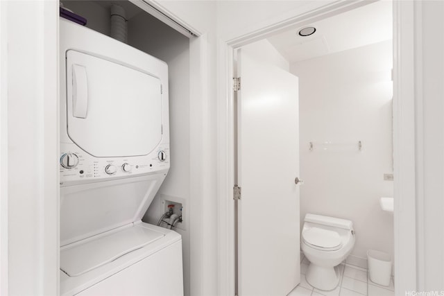 725 Kapiolani Blvd Unit 1201, Honolulu, HI 96813 - washroom with estacked washer and dryer and tile patterned flooring