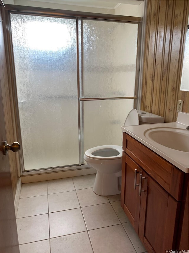 1617 Kamehameha Iv Rd, Honolulu, HI 96819 - bathroom with tile patterned flooring, vanity, a stall shower, and wooden walls
