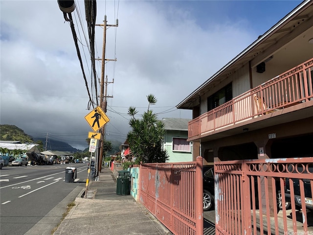 1617 Kamehameha Iv Rd, Honolulu, HI 96819 - view of asphalt street featuring sidewalks, curbs, and traffic signs