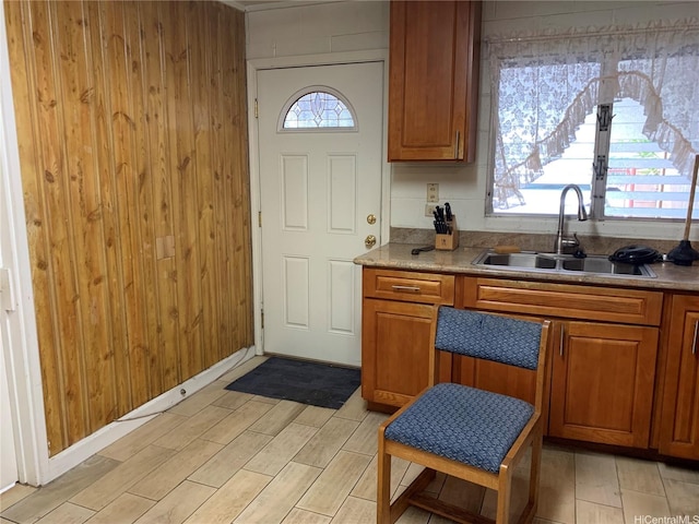 1617 Kamehameha Iv Rd, Honolulu, HI 96819 - kitchen with brown cabinets, light wood-style floors, wood walls, and light countertops