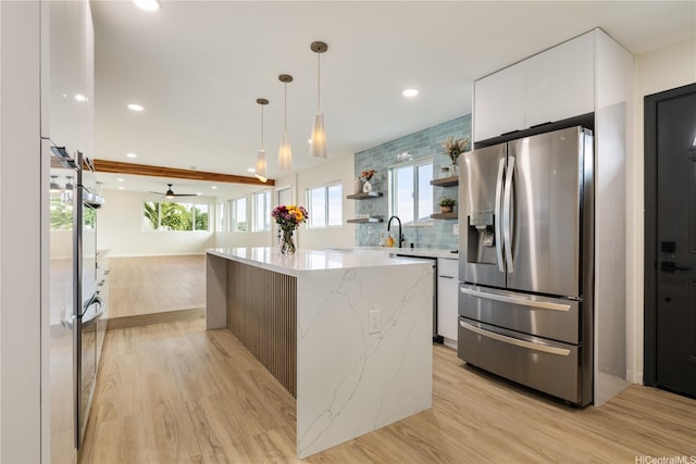 1849 Vancouver Pl, Honolulu, HI 96822 - kitchen featuring appliances with stainless steel finishes, modern cabinets, light wood-style flooring, white cabinets, and recessed lighting