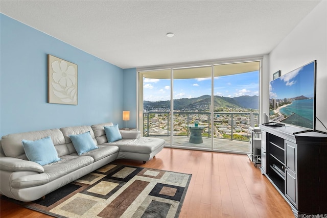 1837 Kalakaua Ave Unit 2209, Honolulu, HI 96815 - living room with floor to ceiling windows and hardwood / wood-style floors