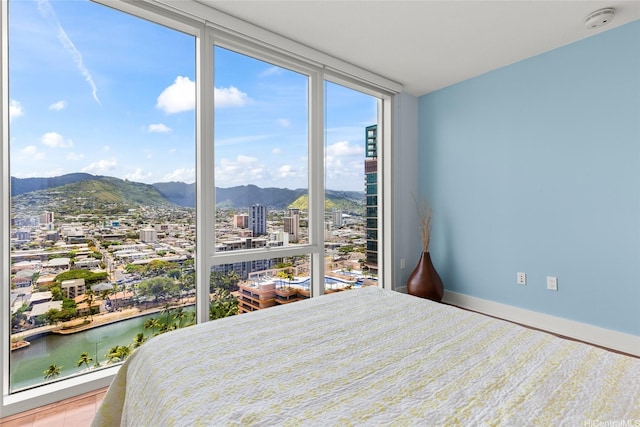 1837 Kalakaua Ave Unit 2209, Honolulu, HI 96815 - bedroom featuring floor to ceiling windows, a city view, and a water and mountain view