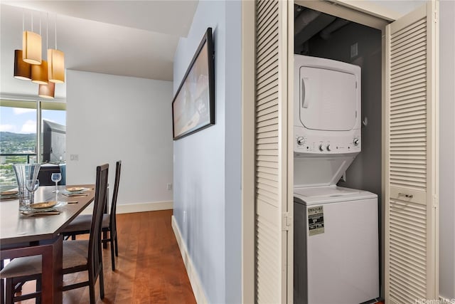 1837 Kalakaua Ave Unit 2209, Honolulu, HI 96815 - laundry room with stacked washing machine and dryer and wood finished floors