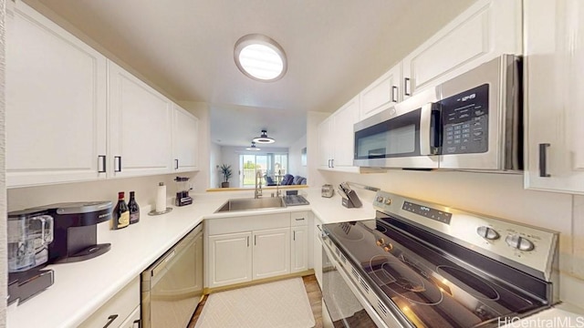 92-1226 Palahia St Unit Cc105, Kapolei, HI 96707 - kitchen featuring stainless steel appliances, white cabinets, and light countertops