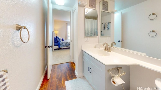 92-1226 Palahia St Unit Cc105, Kapolei, HI 96707 - ensuite bathroom featuring vanity and wood finished floors