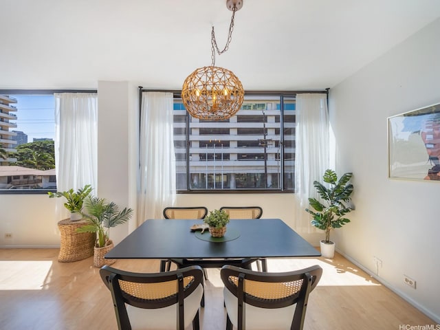 2232 Kapiolani Blvd Unit 303, Honolulu, HI 96826 - dining area featuring a chandelier and wood finished floors