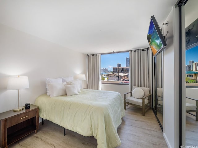 2232 Kapiolani Blvd Unit 303, Honolulu, HI 96826 - bedroom featuring light wood finished floors