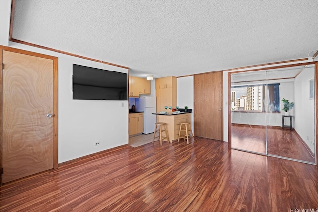 2888 Ala Ilima St Unit 806, Honolulu, HI 96818 - living room featuring wood finished floors and a textured ceiling