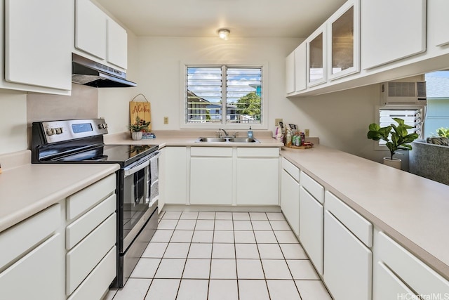 98-219 Pahemo St, Aiea, HI 96701 - kitchen featuring electric stove, under cabinet range hood, light countertops, and white cabinetry