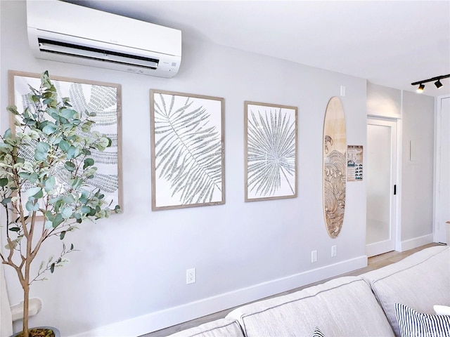 201 Ohua Ave Unit 610, Honolulu, HI 96815 - bedroom with an AC wall unit and baseboards