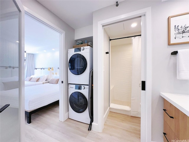 201 Ohua Ave Unit 610, Honolulu, HI 96815 - laundry area with stacked washer / dryer and light wood-type flooring
