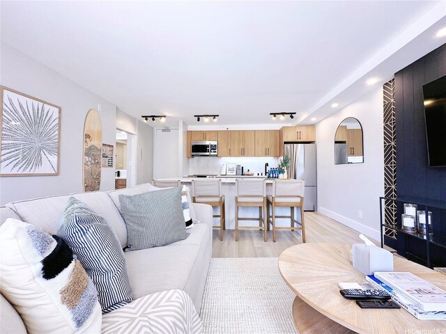 201 Ohua Ave Unit 610, Honolulu, HI 96815 - living area featuring rail lighting, light wood-style floors, and recessed lighting