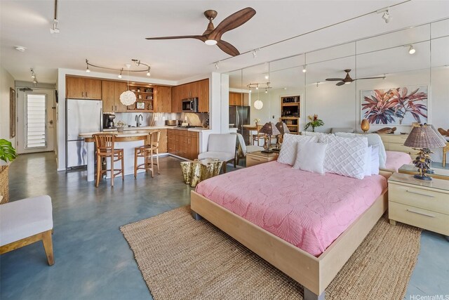 2895 Kalakaua Ave Unit 206, Honolulu, HI 96815 - bedroom featuring freestanding refrigerator, finished concrete floors, and track lighting