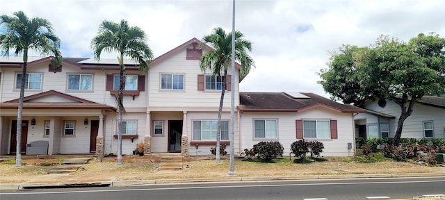 91-6560 Kapolei Pkwy Unit 3G5, Ewa Beach, HI 96706 - view of front of house featuring roof mounted solar panels