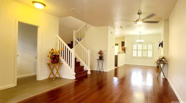 91-6560 Kapolei Pkwy Unit 3G5, Ewa Beach, HI 96706 - foyer featuring wood finished floors, a ceiling fan, stairway, and a chandelier