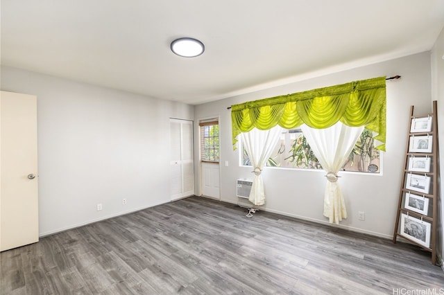 91-1005 Leleoi St Unit 91, Ewa Beach, HI 96706 - empty room featuring wood finished floors and a wall unit AC