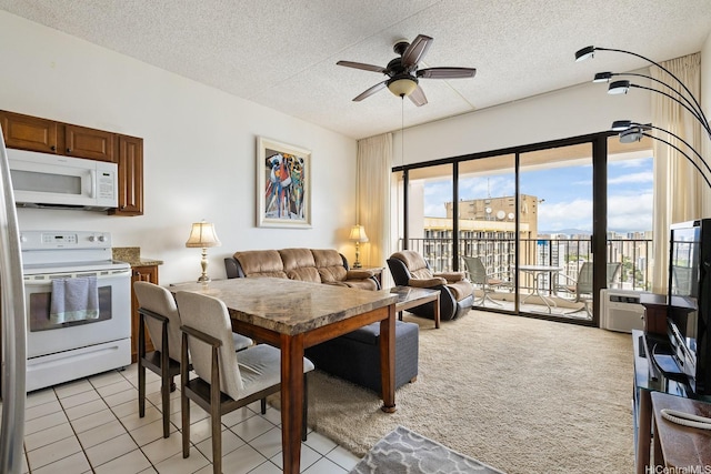 201 Ohua Ave Unit 3702-1, Penthouse Honolulu, HI 96815 - dining area with a ceiling fan, a textured ceiling, light carpet, and light tile patterned flooring