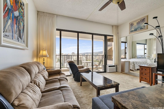201 Ohua Ave Unit 3702-1, Penthouse Honolulu, HI 96815 - living room with carpet flooring, ceiling fan, and a textured ceiling