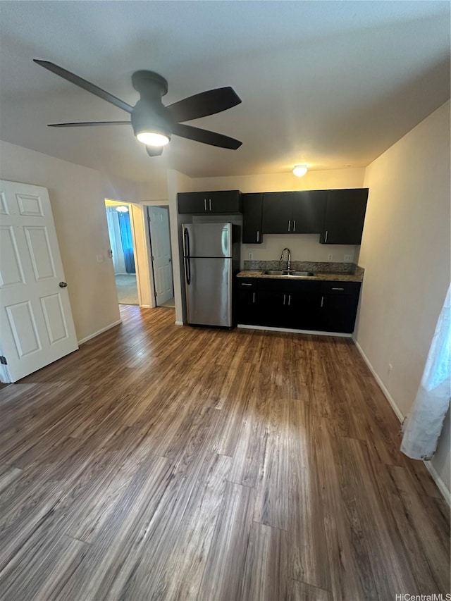 1817 Kalie Pl Unit B, Wahiawa, HI 96786 - kitchen with freestanding refrigerator, dark cabinets, ceiling fan, and dark wood finished floors