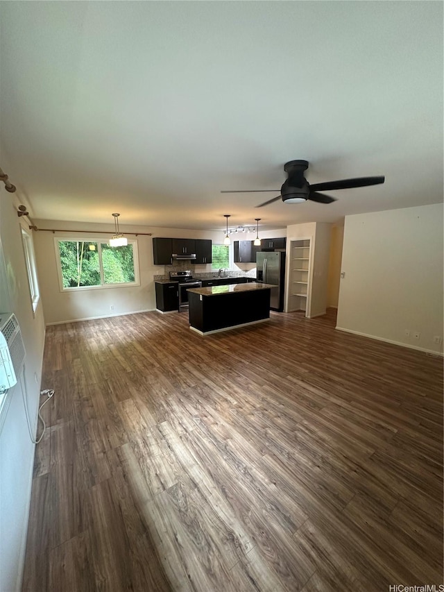 1817 Kalie Pl Unit B, Wahiawa, HI 96786 - unfurnished living room with dark wood-type flooring, ceiling fan, and healthy amount of natural light