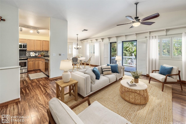 91-1037 Paaoloulu Way, Kapolei, HI 96707 - living area featuring dark wood-type flooring, healthy amount of natural light, lofted ceiling, a ceiling fan, and a chandelier