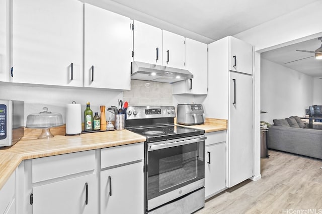 96-226 Waiawa Rd Unit 46, Pearl City, HI 96782 - kitchen featuring under cabinet range hood, stainless steel appliances, light countertops, and open floor plan