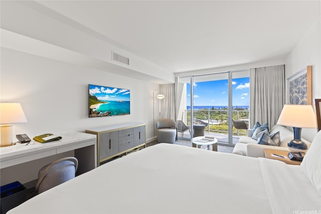 383 Kalaimoku St Unit 1006, Honolulu, HI 96815 - bedroom with access to exterior, expansive windows, and built in study area
