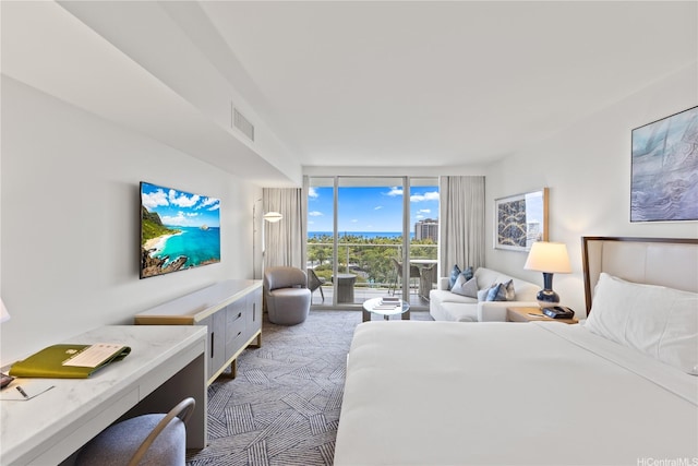 383 Kalaimoku St Unit 1006, Honolulu, HI 96815 - bedroom featuring access to exterior, floor to ceiling windows, and carpet floors