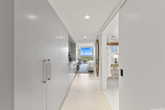 383 Kalaimoku St Unit 1006, Honolulu, HI 96815 - corridor featuring light tile patterned floors and recessed lighting
