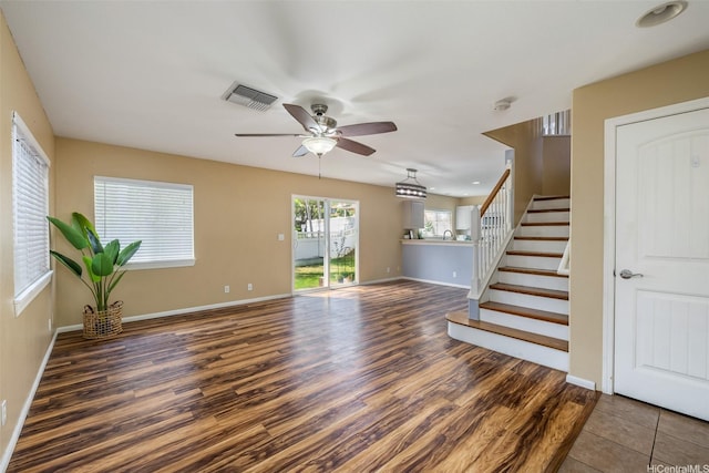 87-2165 Pakeke St Unit 59, Waianae, HI 96792 - unfurnished living room featuring a ceiling fan, stairs, and wood finished floors