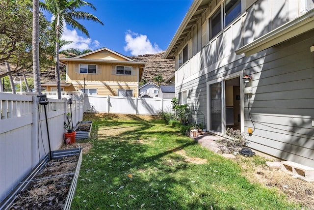 87-2165 Pakeke St Unit 59, Waianae, HI 96792 - fenced backyard with a vegetable garden