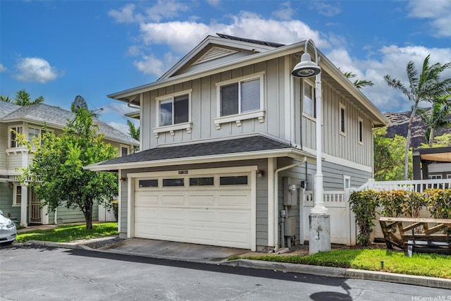87-2165 Pakeke St Unit 59, Waianae, HI 96792 - view of front facade with board and batten siding and a garage