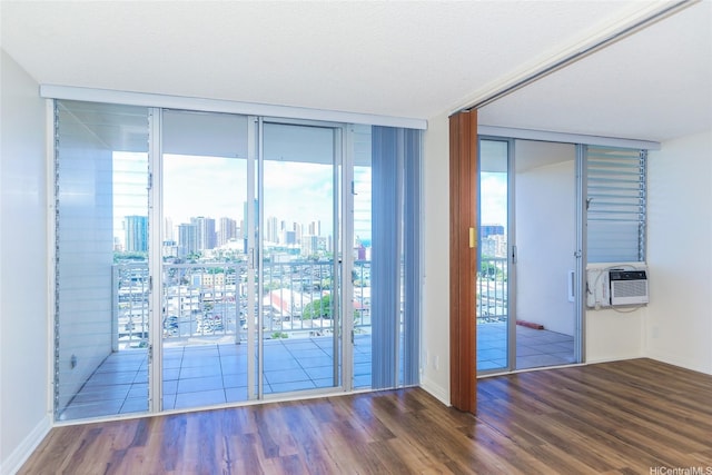 1215 Alexander St Unit 1201, Honolulu, HI 96826 - spare room featuring expansive windows, wood finished floors, and a view of skyline