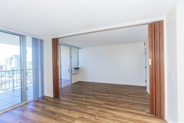 1215 Alexander St Unit 1201, Honolulu, HI 96826 - spare room with wood finished floors, cooling unit, and expansive windows
