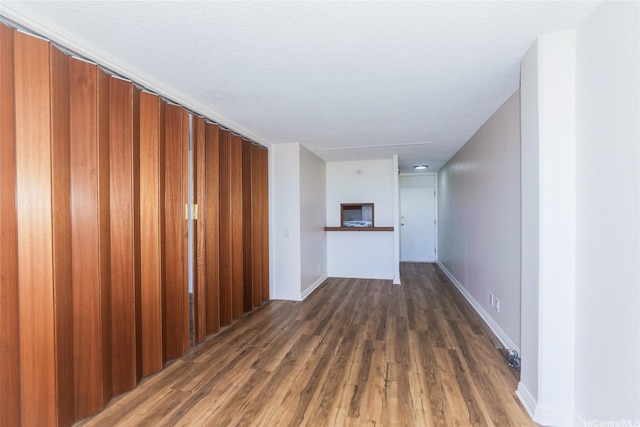 1215 Alexander St Unit 1201, Honolulu, HI 96826 - unfurnished living room with wood finished floors and baseboards