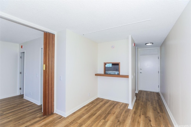 1215 Alexander St Unit 1201, Honolulu, HI 96826 - spare room with wood finished floors and a textured ceiling